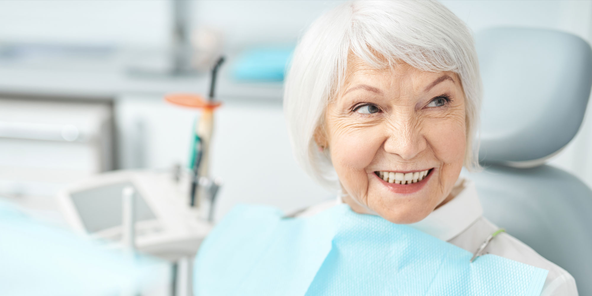 dental patient missing teeth discussing options implants2